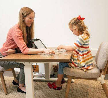 A child undergoing neuropsychological evaluation with a professional in a calm setting