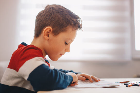 Boy doing his school work or homework
