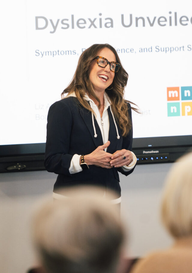 Dr. Liz Adams presenting on dyslexia assessment during educational seminar